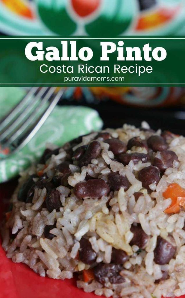 A red bowl of rice with a fork.