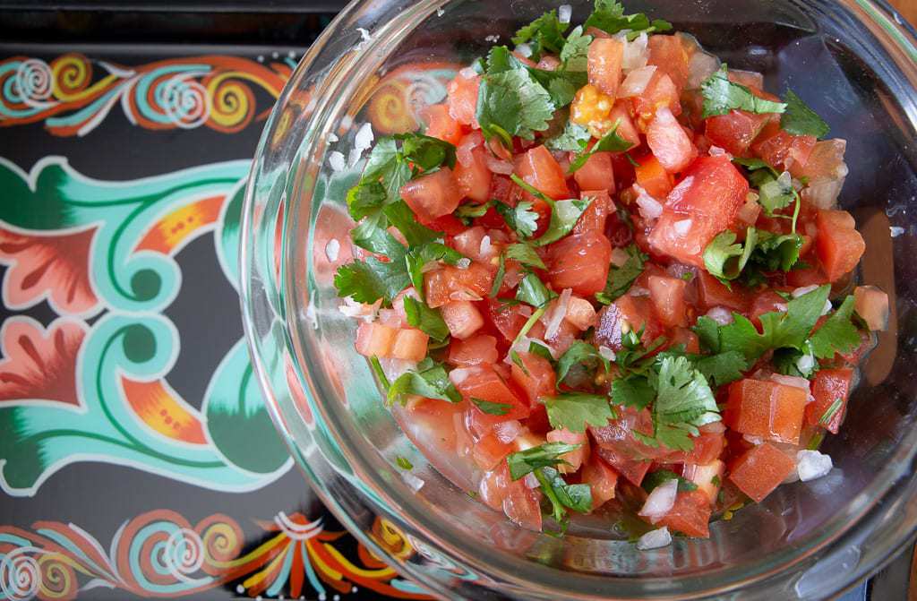 lime juice with white onion, cilantro and onion chimichurri tico