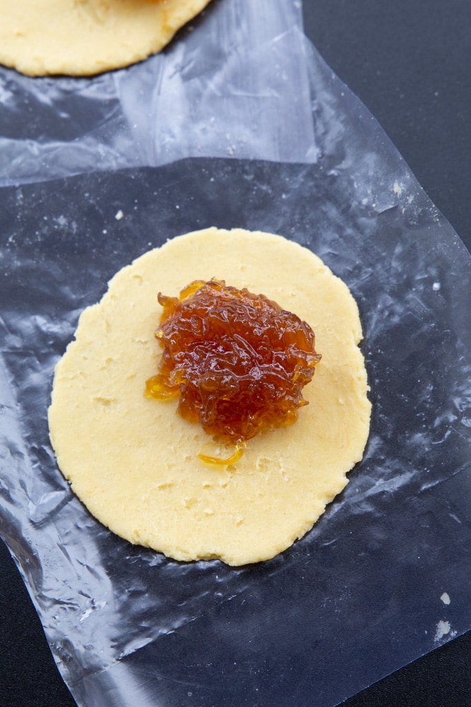 dough with filling on plastic