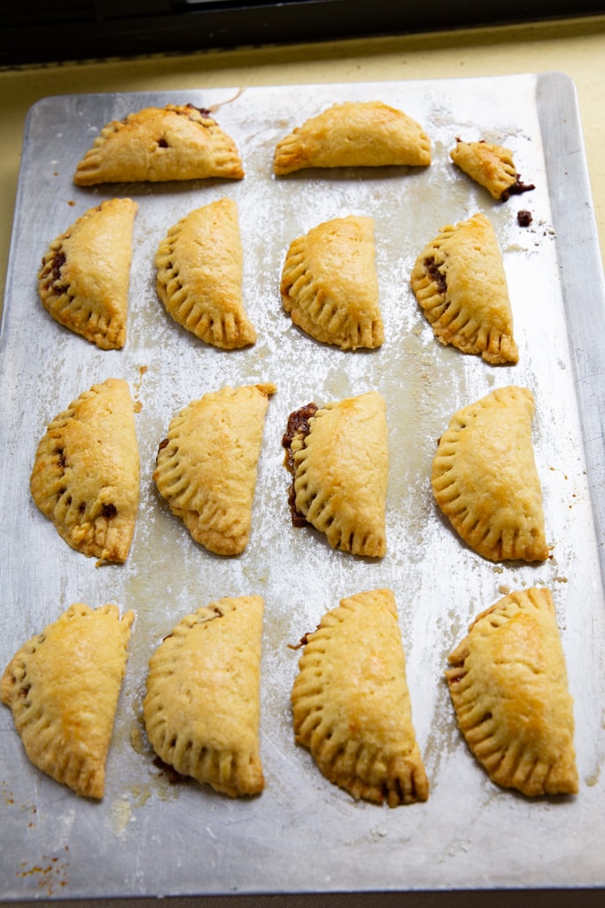 empanadas de chiverre on a baking sheet
